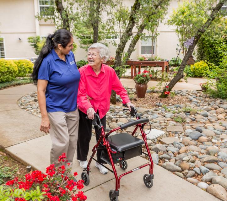 Resident and staff taking a walk