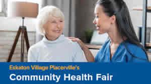 Staff and resident smiling at each other.