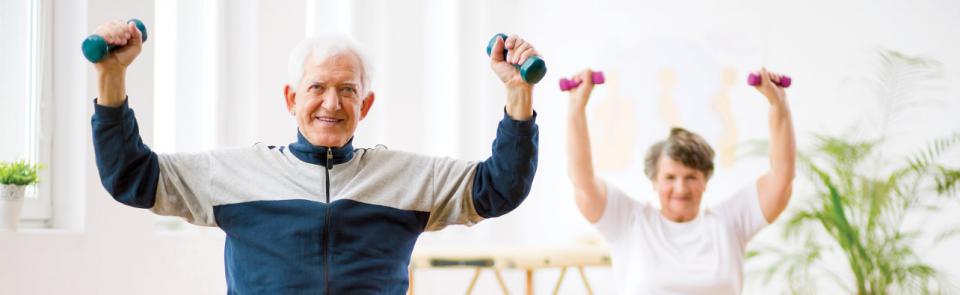 Couple exercising with hand weights